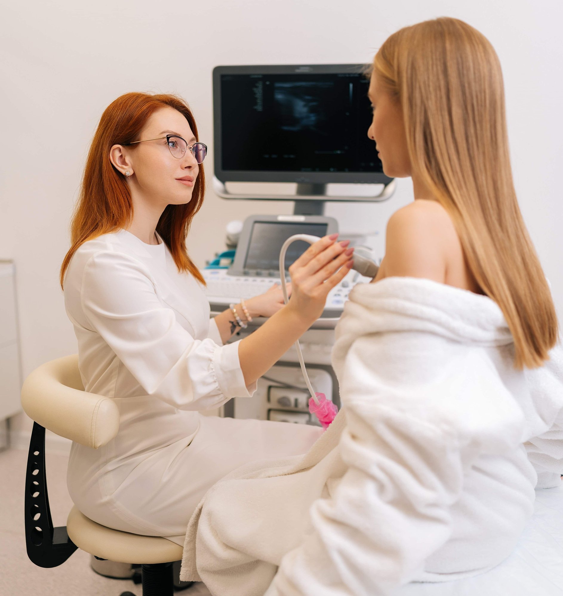 young woman getting breast examination_753216290-min-1